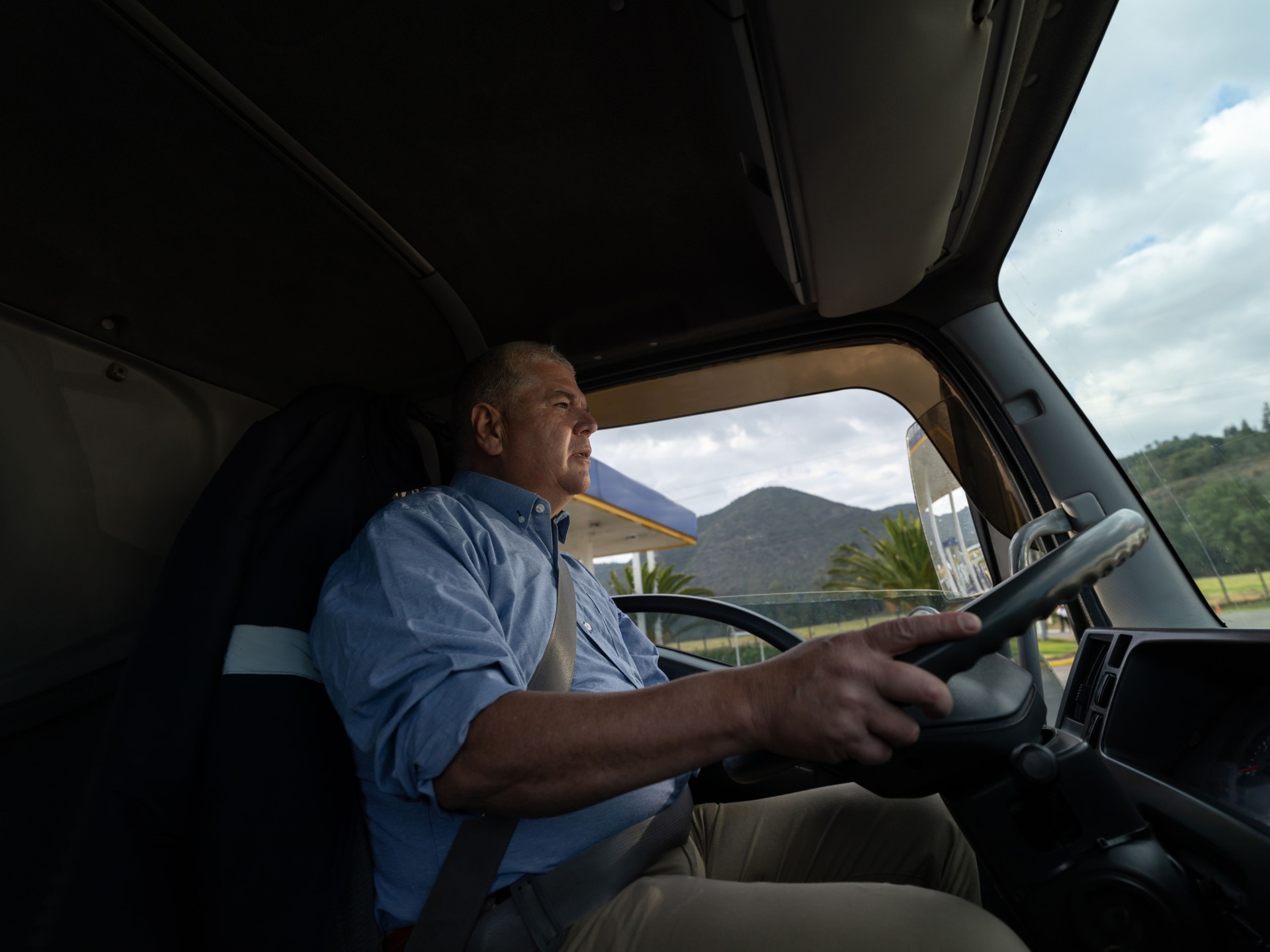 Latin american mature man driving a truck