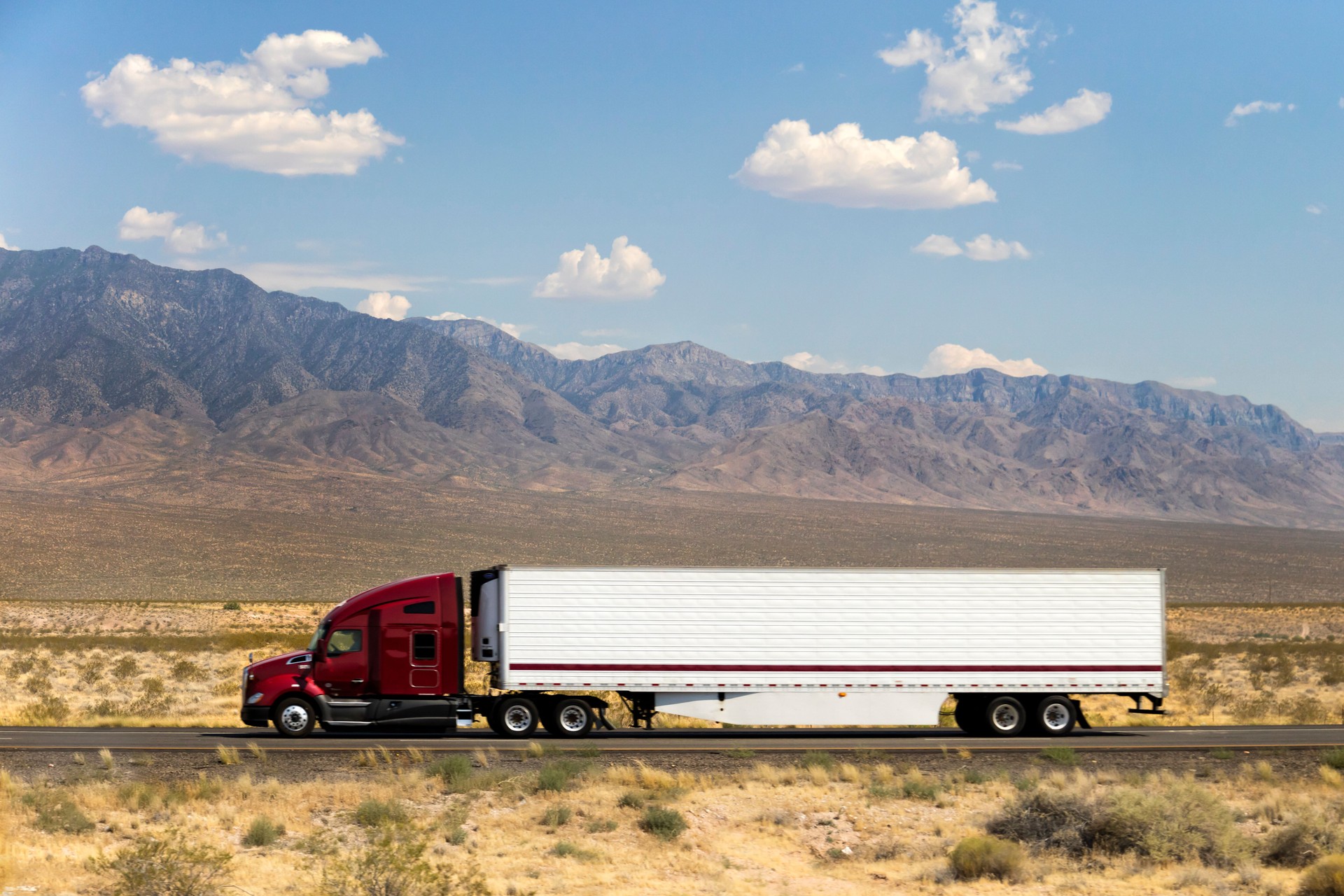 Fast and Powerful Heavy-Lift Modern Semi Truck Speeding on Highway, California, USA
